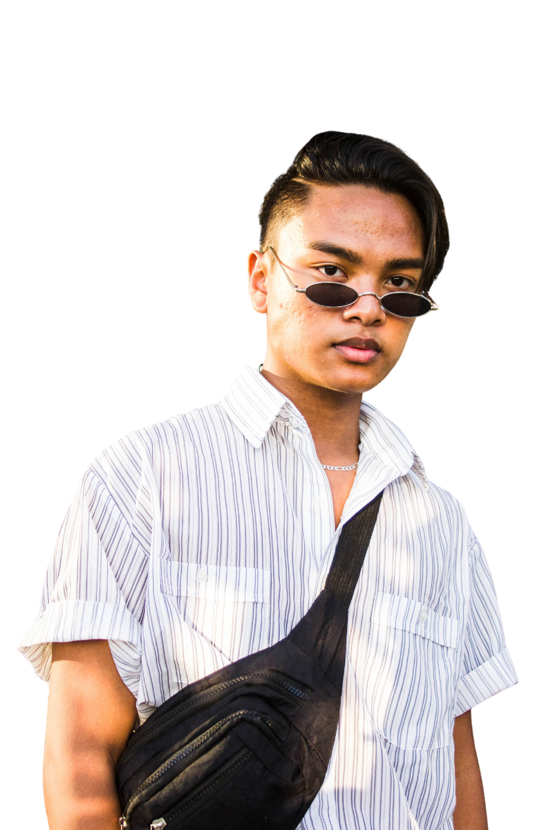 A young South East Asian man wearing a short-sleeve striped shirt and a cross body black bag