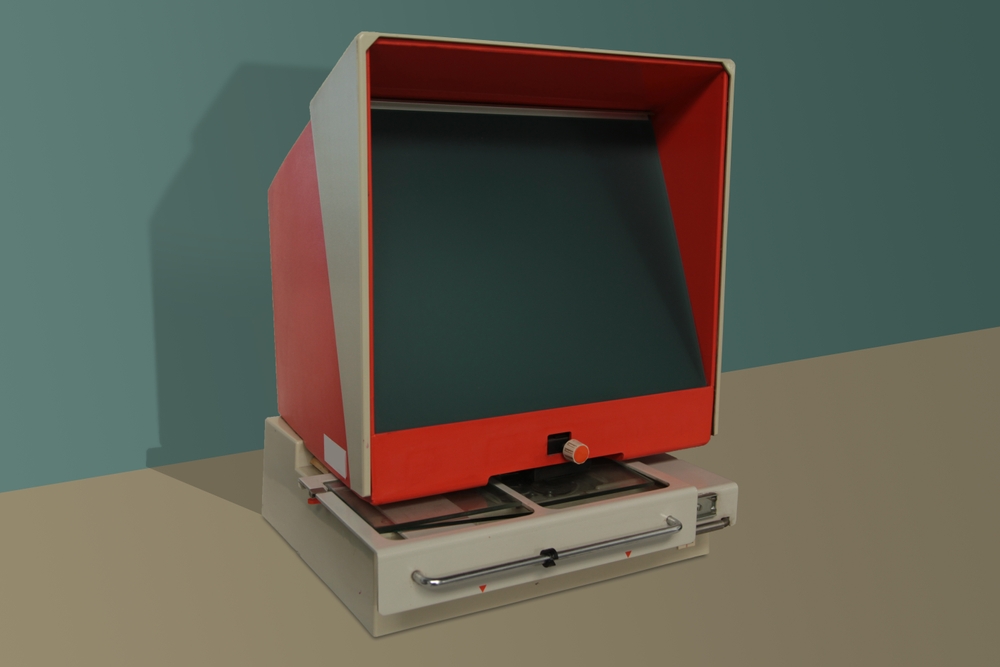Old,Microfiche,Reader,Is,A,Device,Composed,Of,A,Large A picture of an old microfiche reader. It is red and beige in colour.